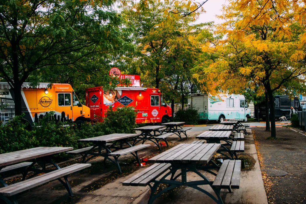 a red yellow and white food truck