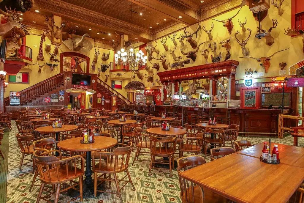 a restaurant with brown furniture and historic decorations