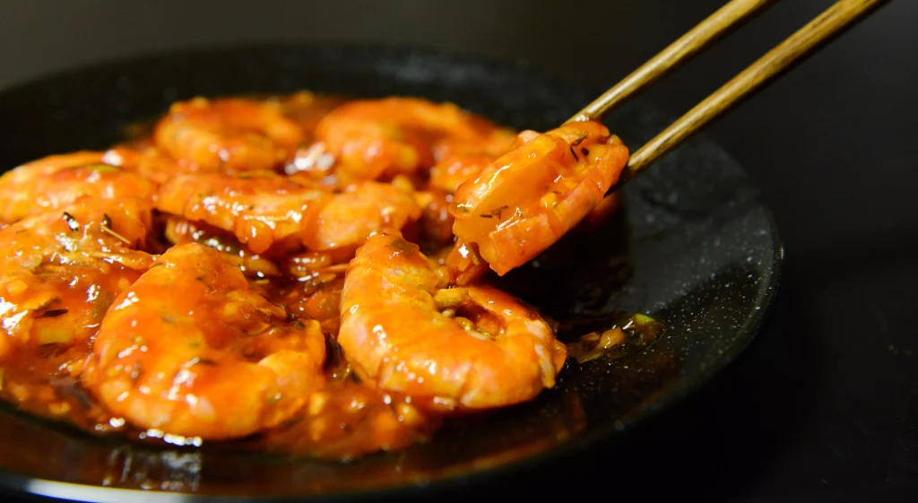 seafood in a black color porculan plate