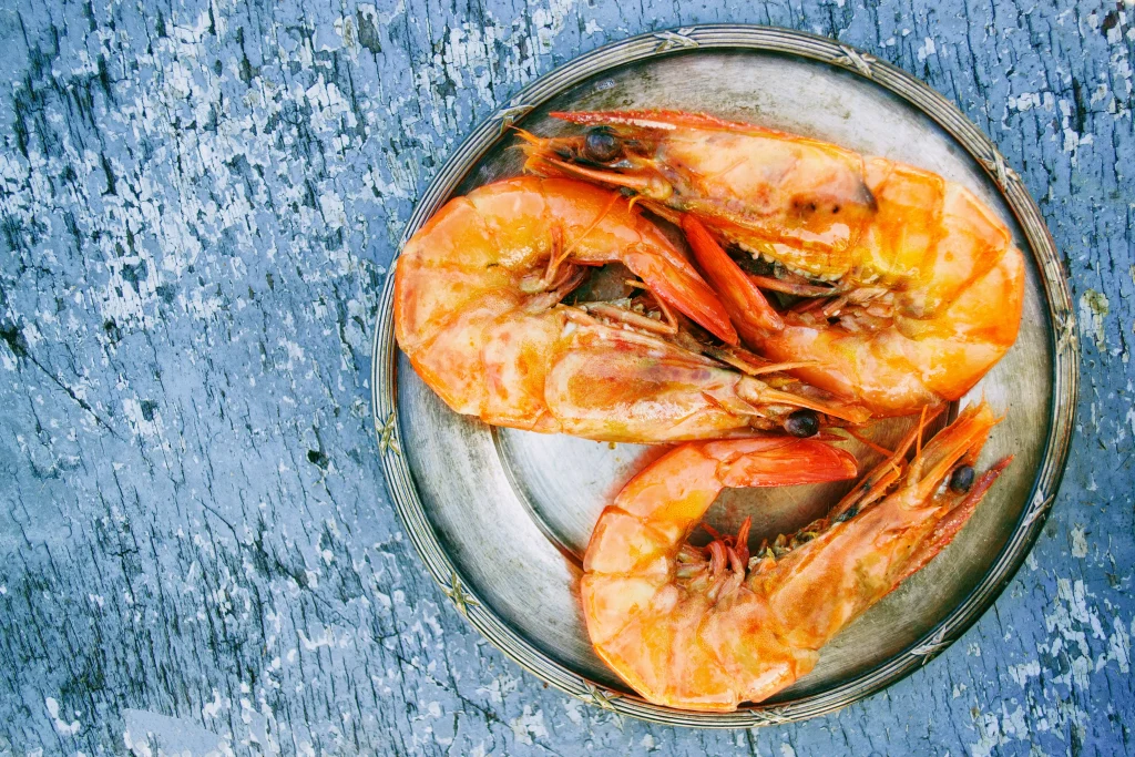 seafood in a porculan plate on a blue table