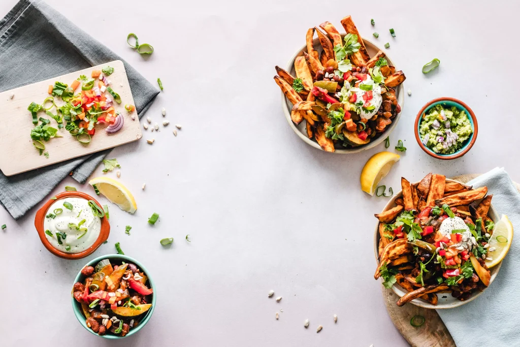 different types of food on a table with white cloth