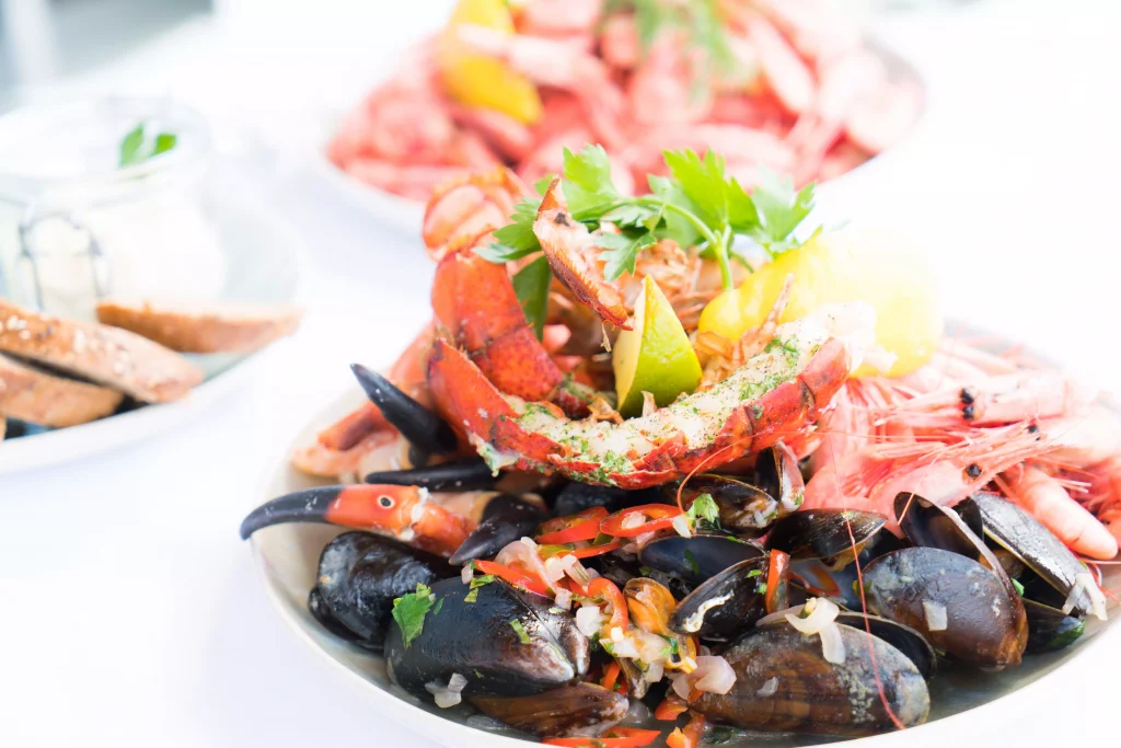 white poruclan plate full of seafood