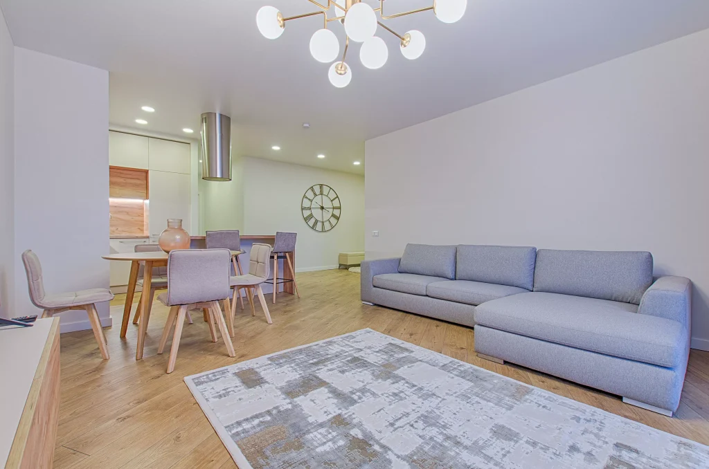 simplistic living room with a white carpet and a lot of lights