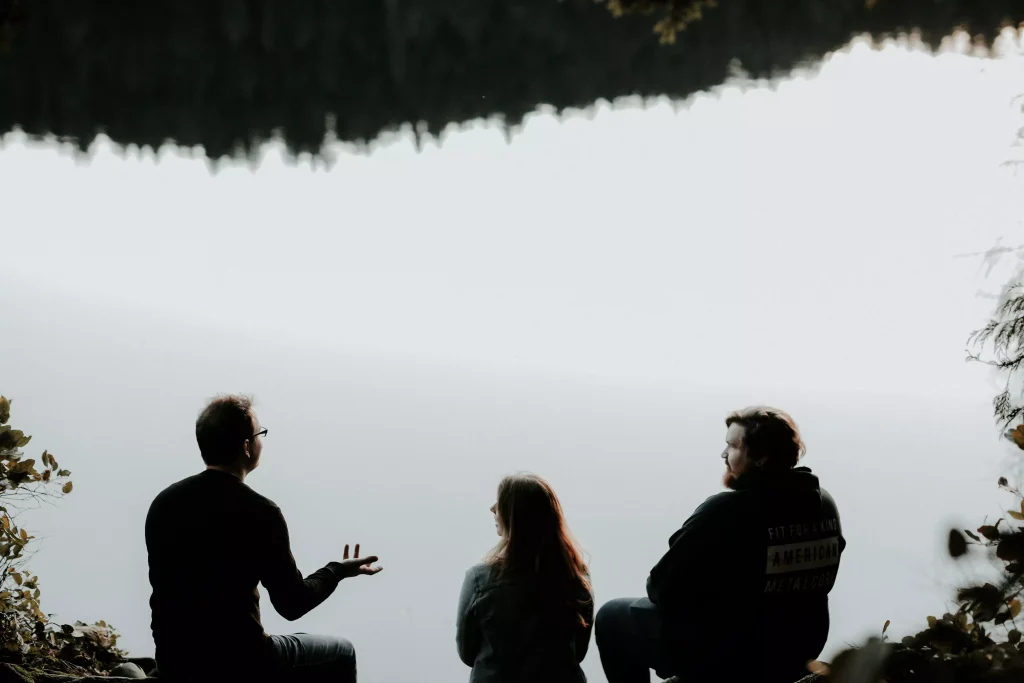 three people talking with each other