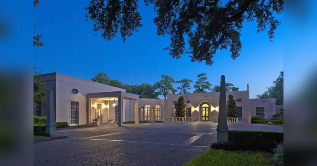 a modern looking house photographed at night