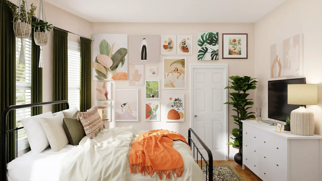 a bed with an orange blanket on it next to some white furniture