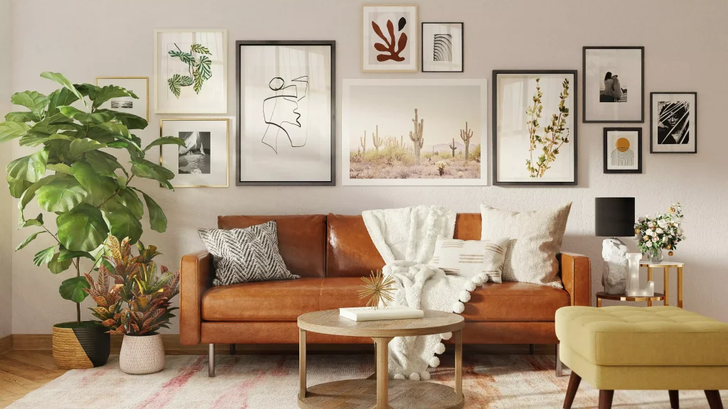 a brown leather couch next to a white blanket and a plant