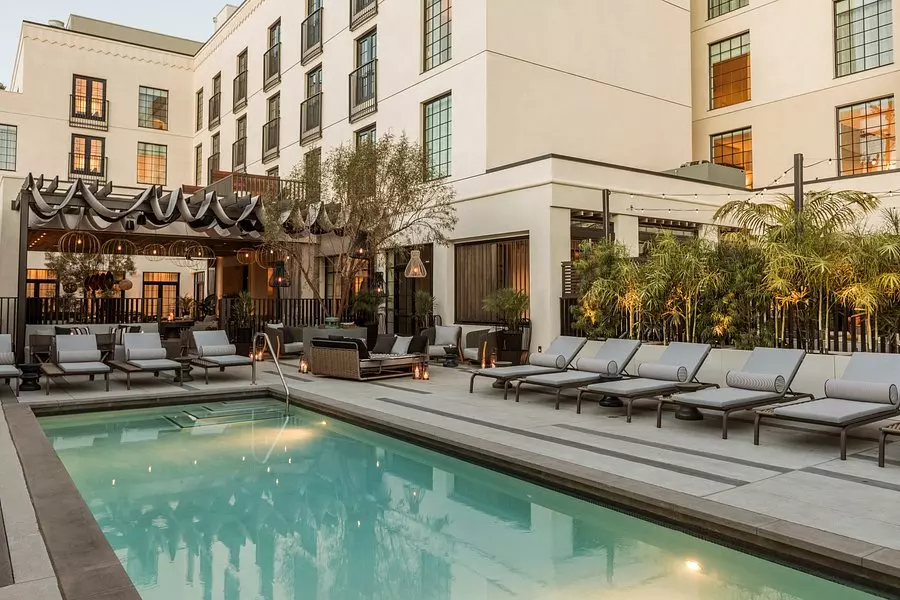 a pool next to a white building