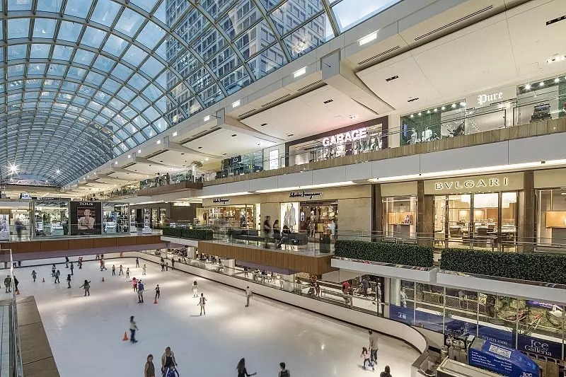 inside of a glass structure with a lot of lights