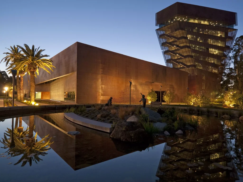 a brown building photographed at night 