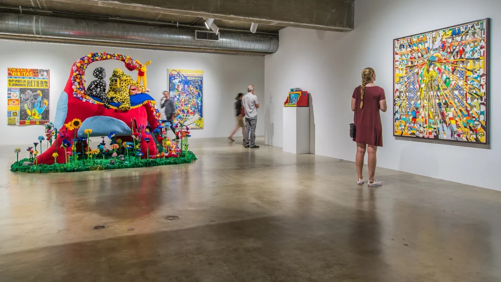 a women looking at a picture in a museum