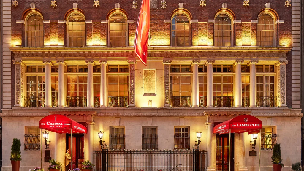 a building with two entrances which are marked by red signs