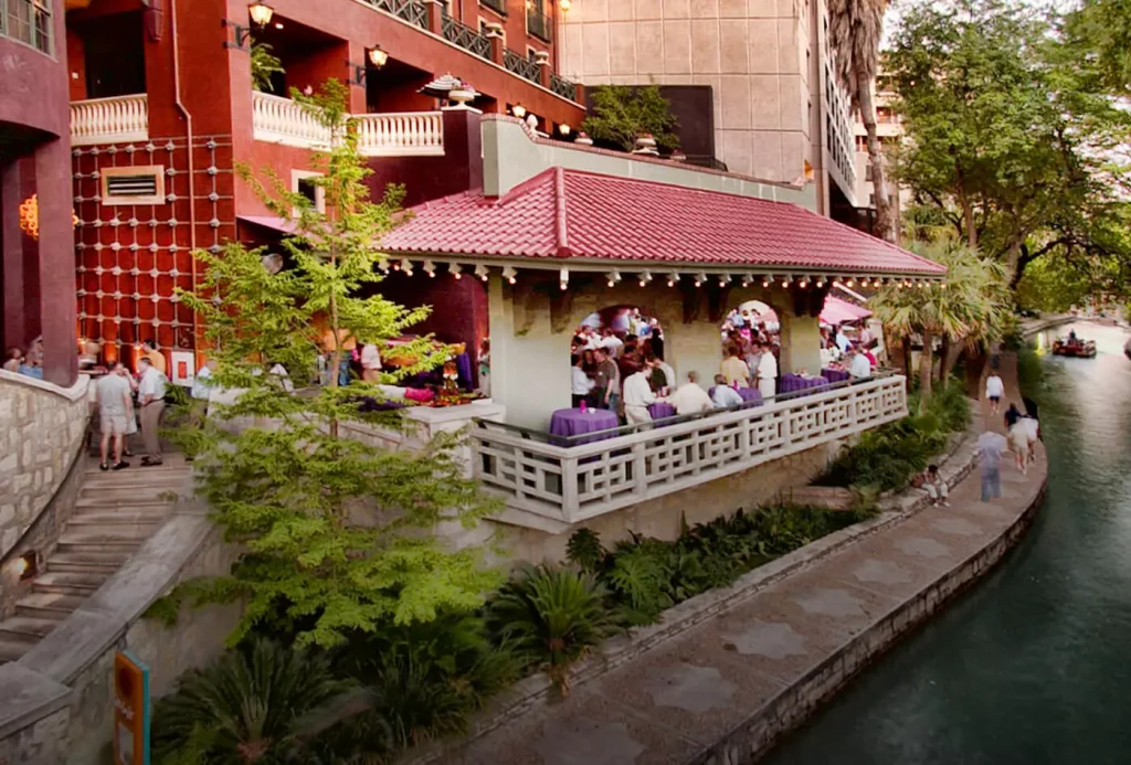 a balcony above a river in a city