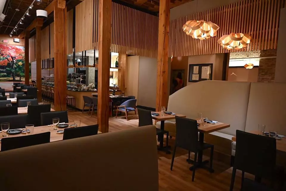 restaurant tables and chairs photographed inside the building