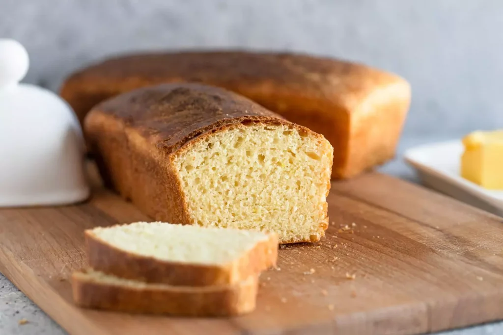 yellow bread sliced on a wooden table