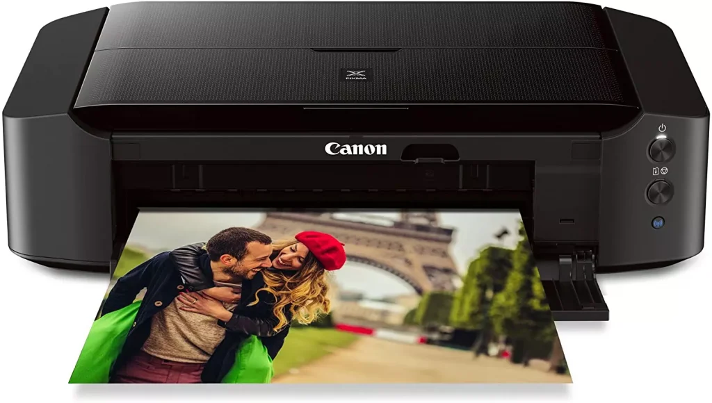 a black color printer printing a picture of a couple in Paris