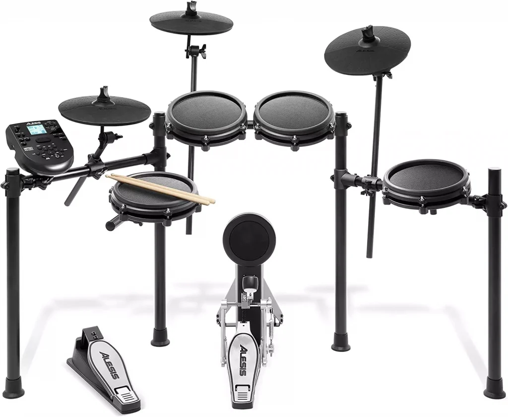 digital drum set with drum sticks next to it