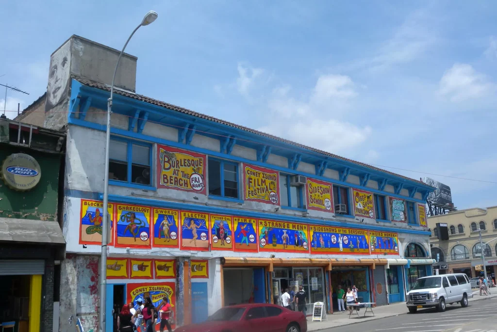 a house with blue pink and yellow posters on it