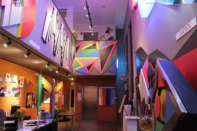 photo inside of a building with colorful geometric paintings on the walls