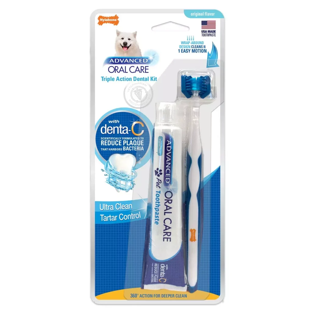 a blue and white toothbrush next to toothpaste