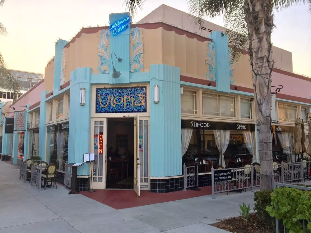 traditional looking building with blue windows and white walls