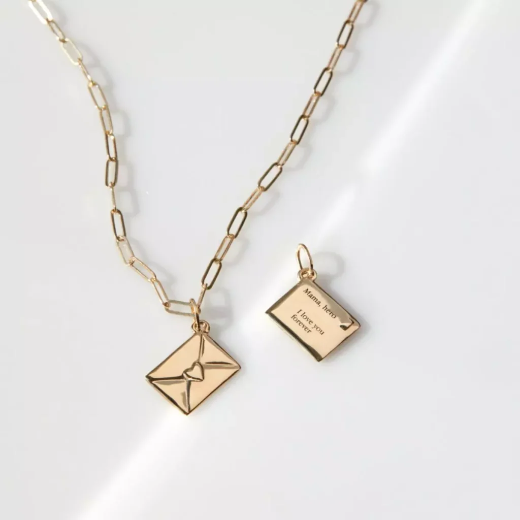 a necklace with a letter tag