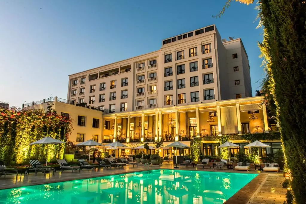 a hotel photographed from the pool nearby