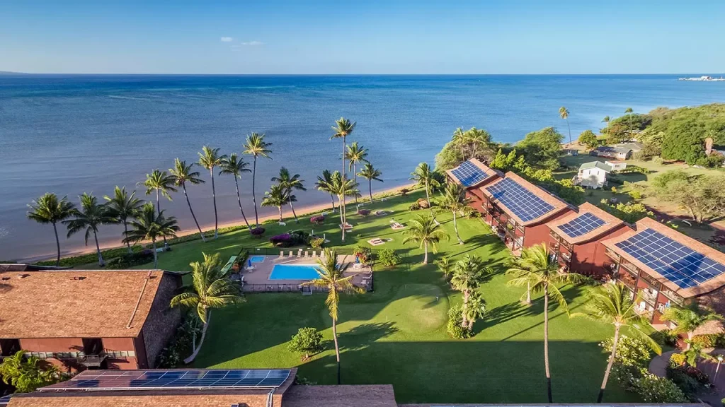 houses with solar panels on the sea