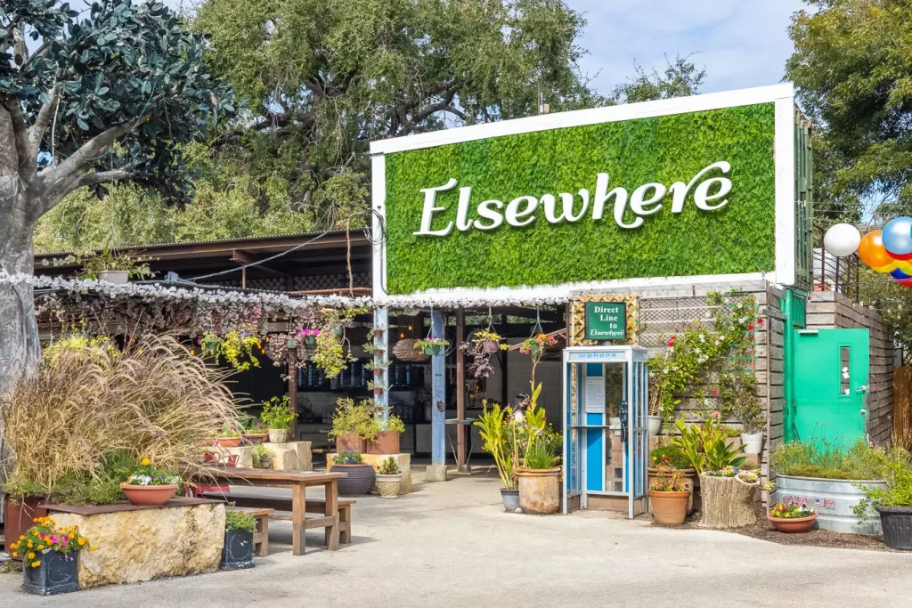 a restaurant with a green logo