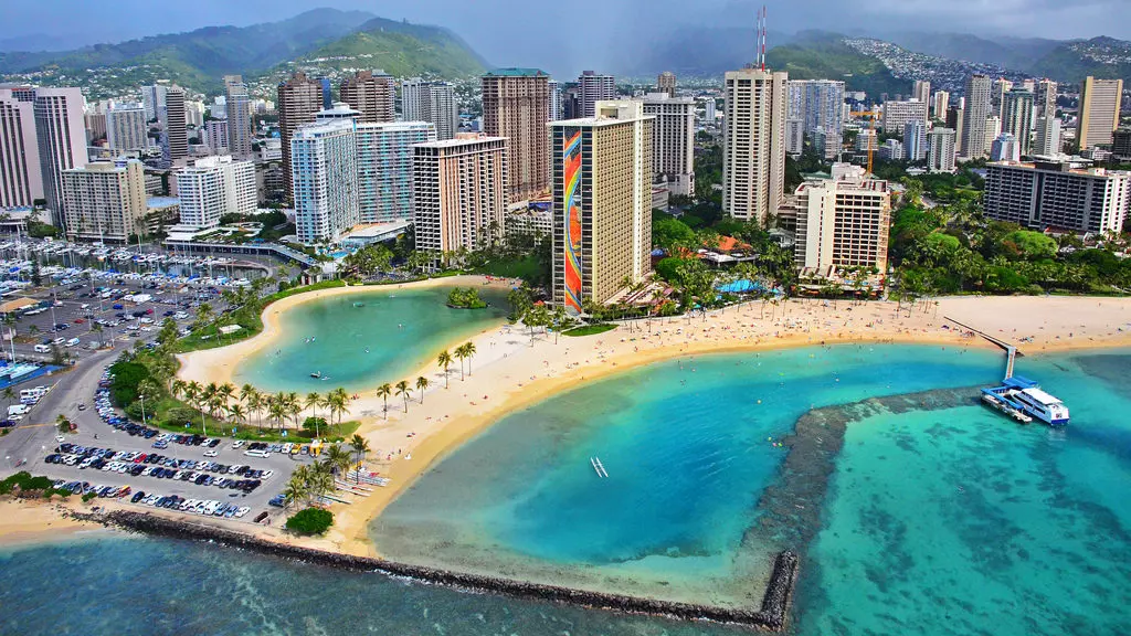 a city on the beach with big buildings