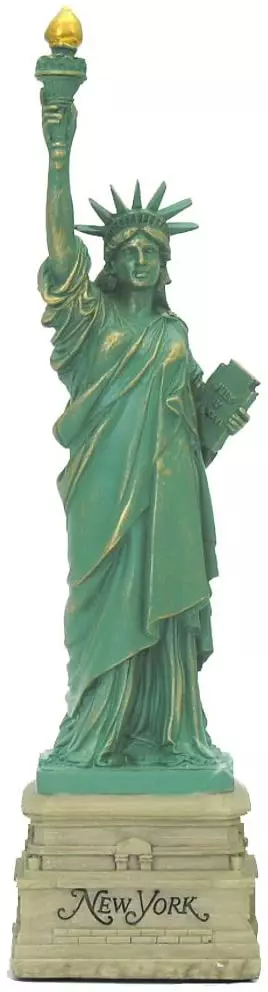 a statue holding one hand up holding a torch