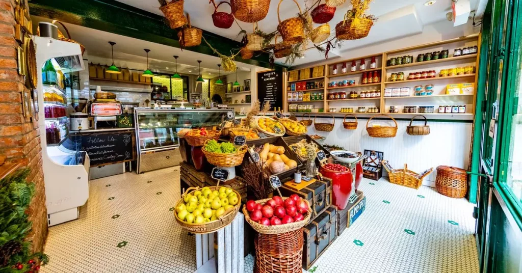 a grocery store with boxes of vegetables in the center of it