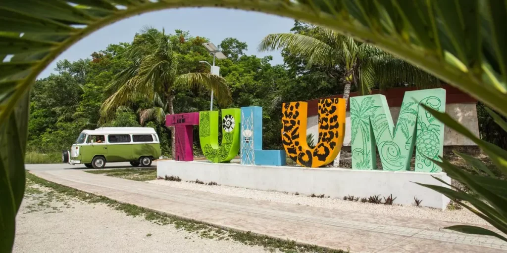 a van next to big letters spelling TULUM