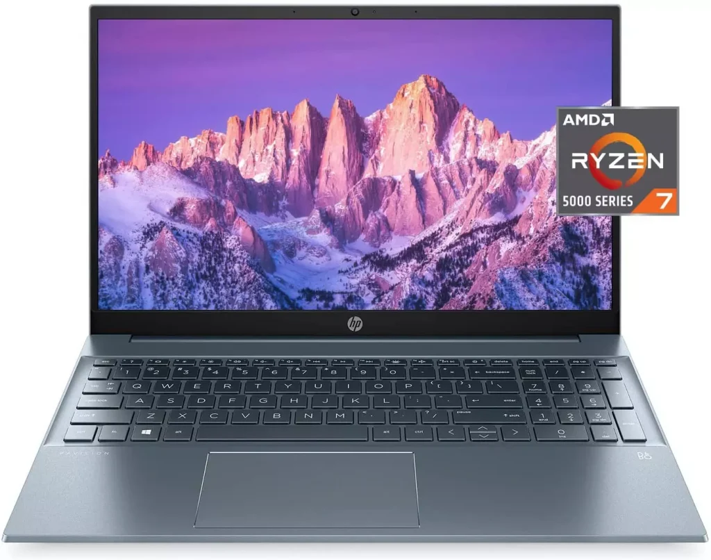 a laptop with mountains as its background photographed from the front