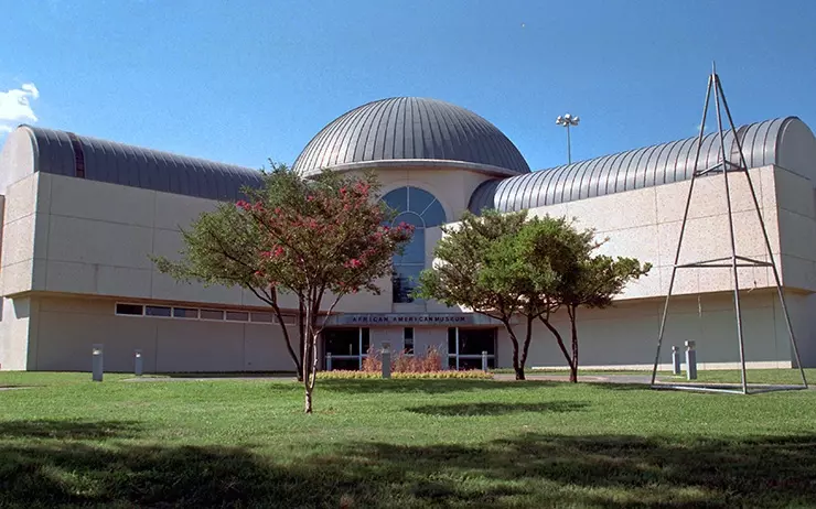 a white building with a circle dom on the top