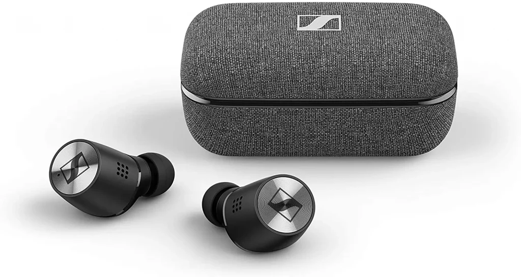 grey color ear buds case next to the ear buds