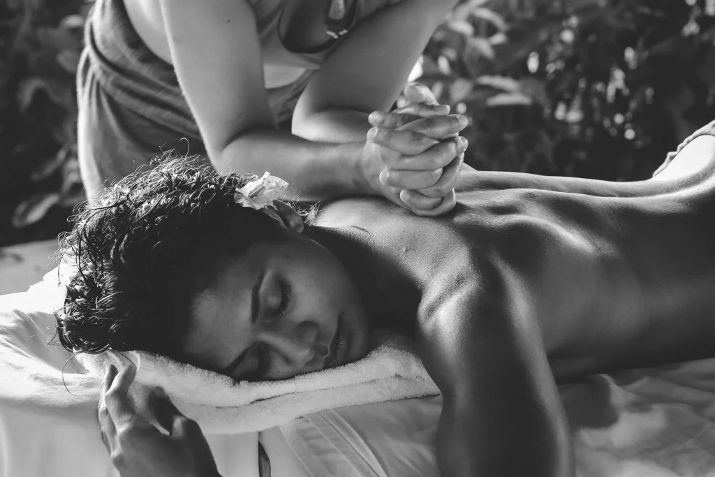 black and white image of a women getting a massage