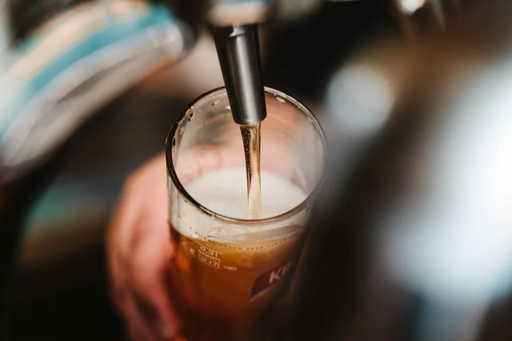 a bartender sipping beer