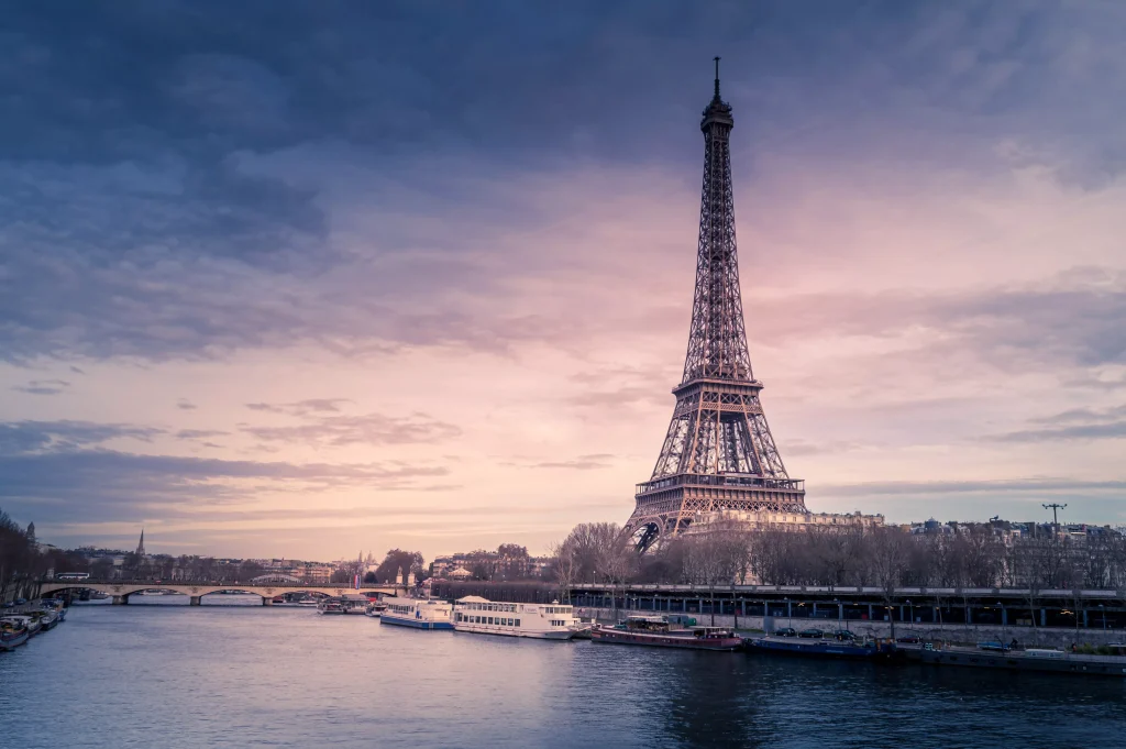 the Eifel tower next to the river in Paris