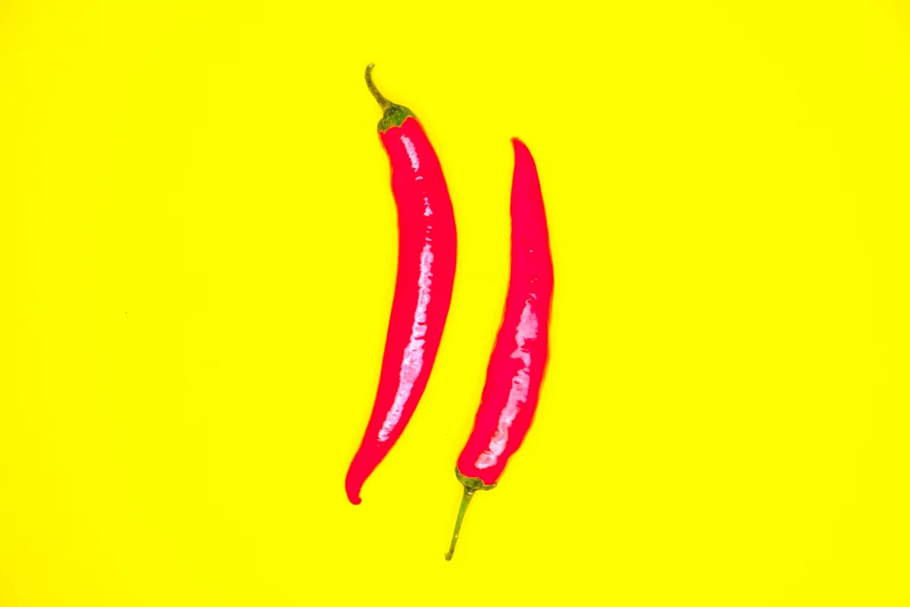 red peppers on a yellow background