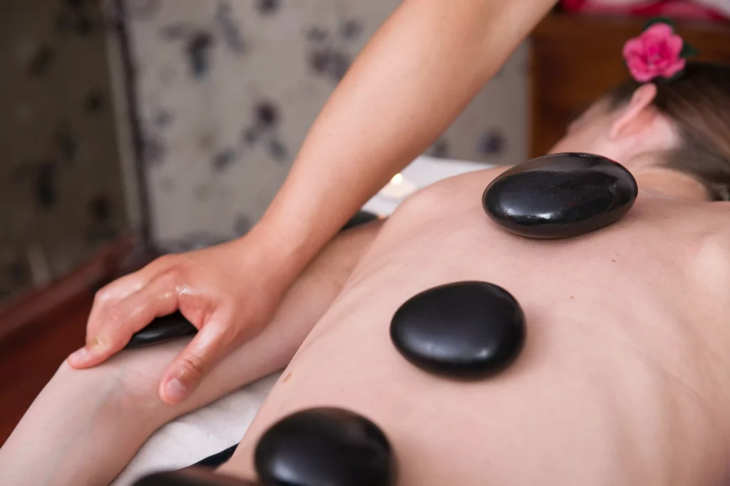 a women getting a hot stones massage