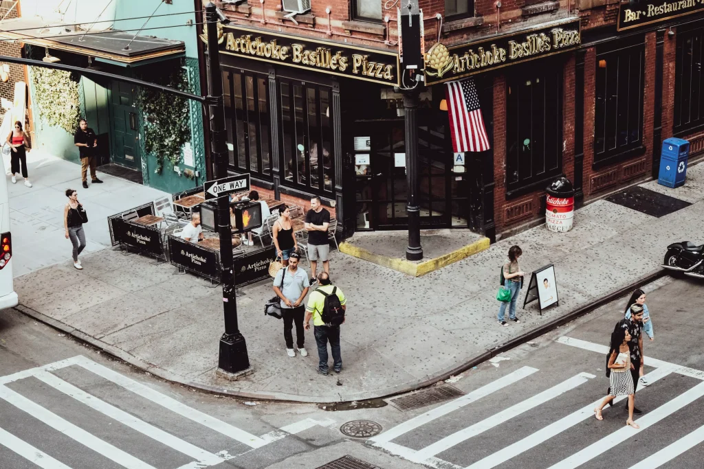 a city street photographed from a balcony