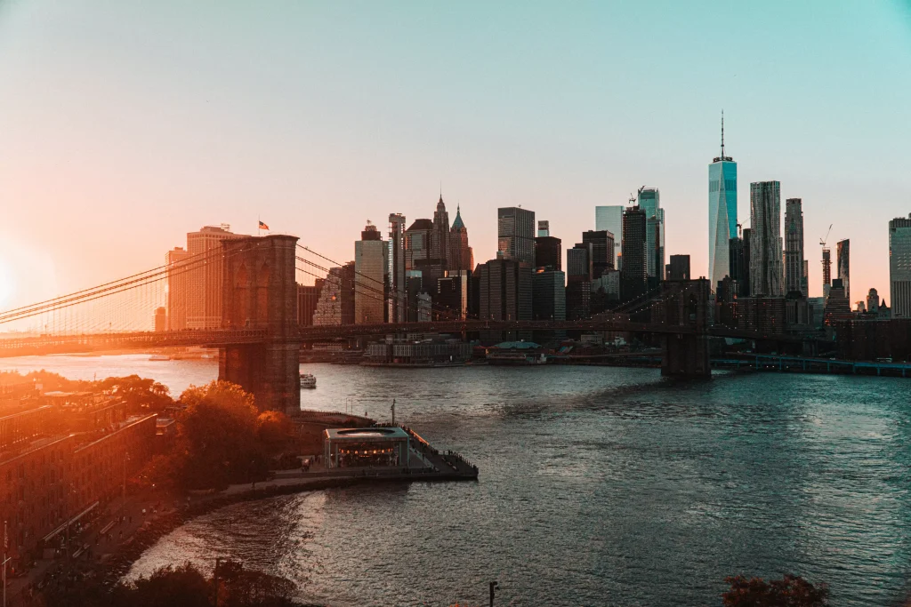 a bridge above a river conecting two cities