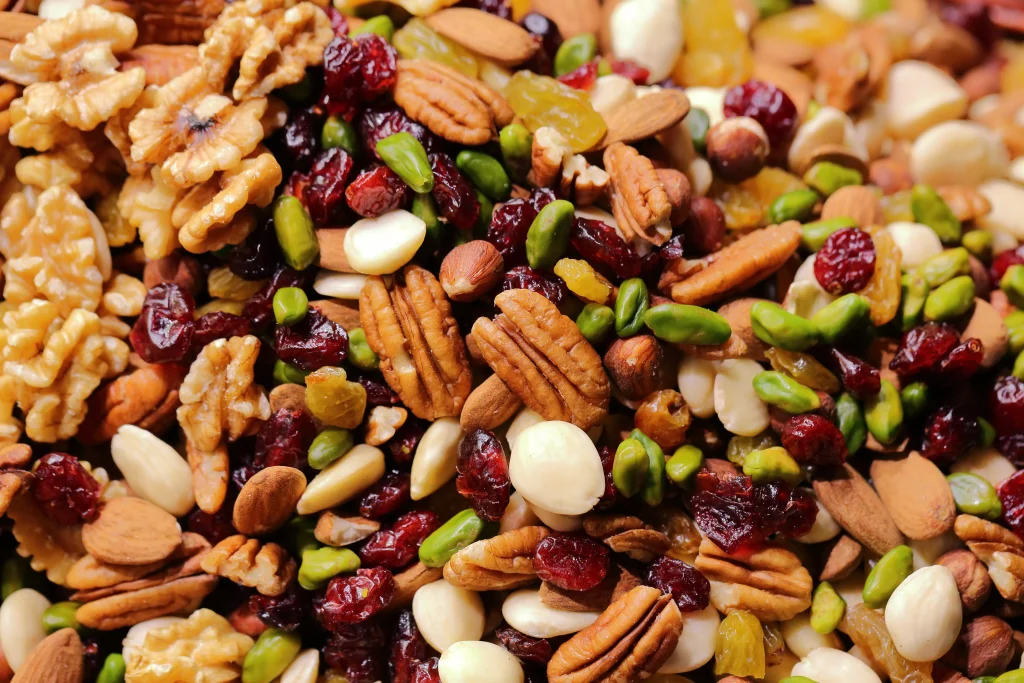 different types of nuts spilled on a brown table