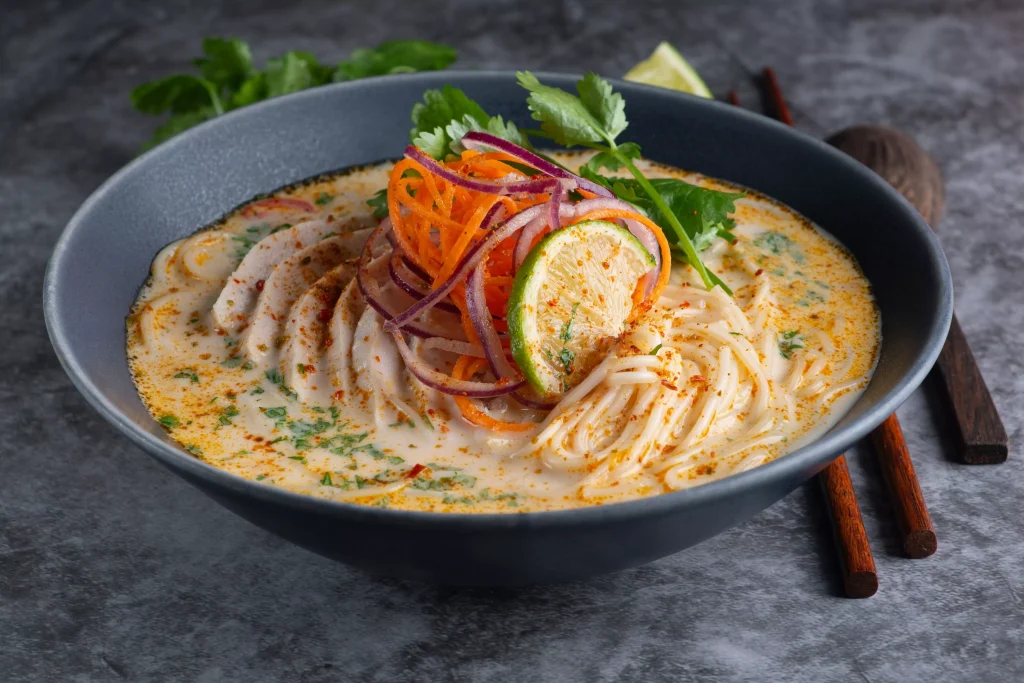 pasta with green salad in yellow sauce