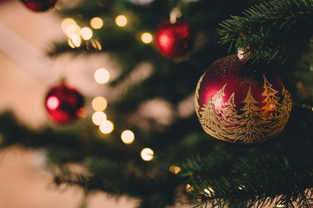 red Christmas ornaments on a tree