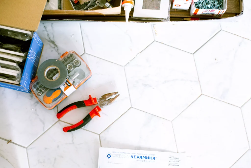 red pliers on a white table