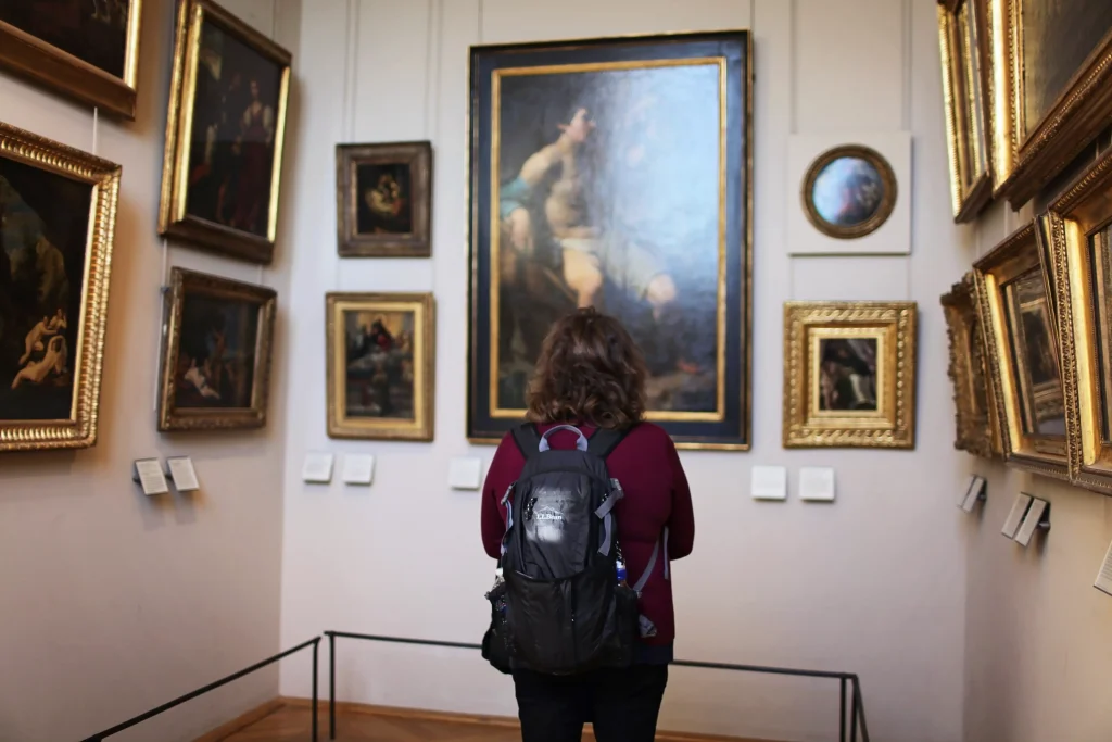 a girl looking at art in a museum