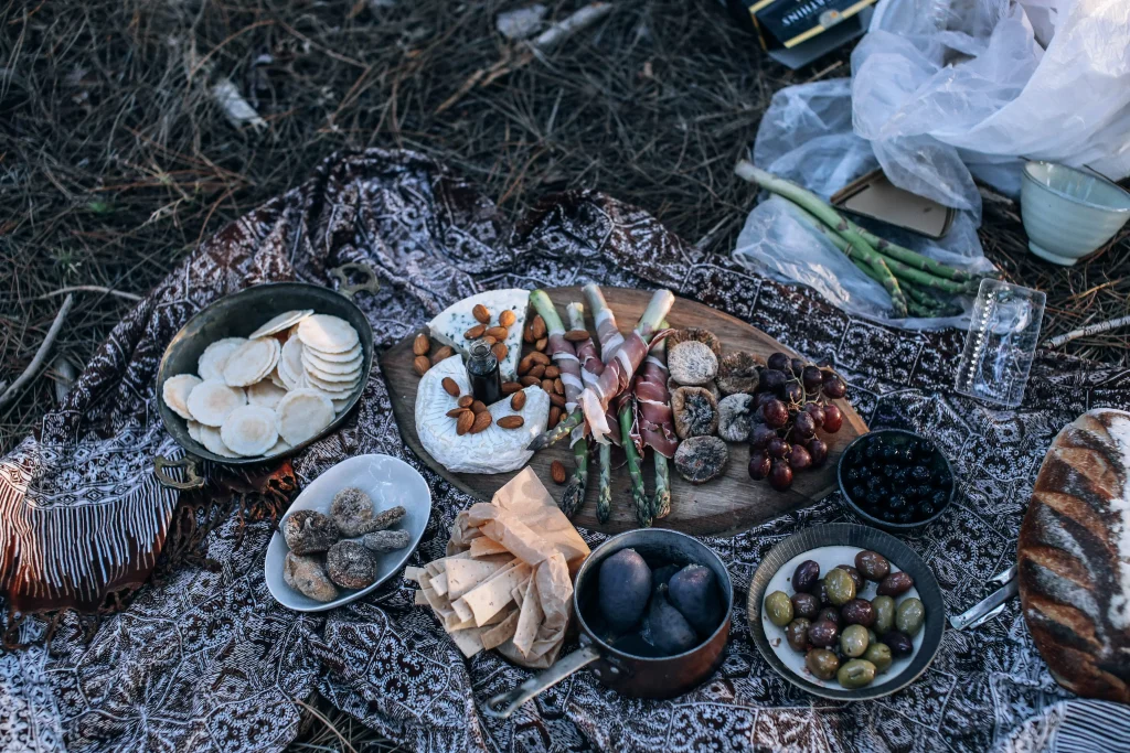 food on a blanket on grass