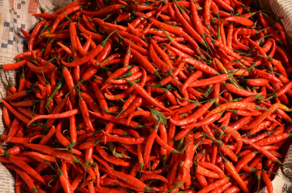 mild red peppers organized in a circle bowl